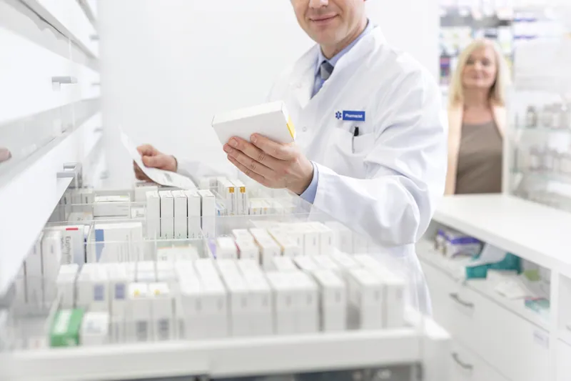Pharmacist organizing medications